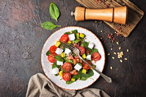 Salad of red fish, feta, avocado and cherry tomatoes