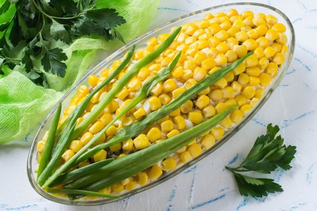 Puff salad with corn, crab sticks and mushrooms