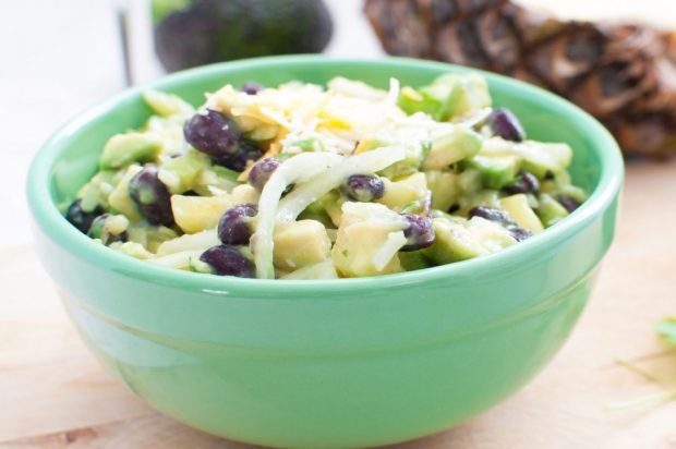 Salad of cucumbers, red beans, pineapple and avocado 