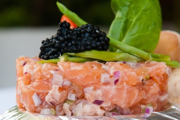 Chopped salad with sea cocktail and salmon