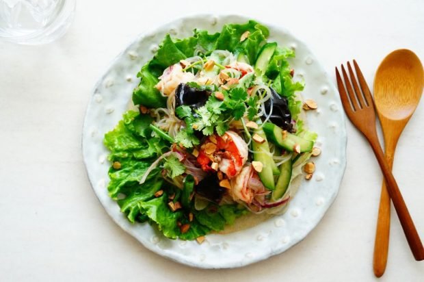 Salad of funchosa, shrimp, wood mushrooms and cucumbers