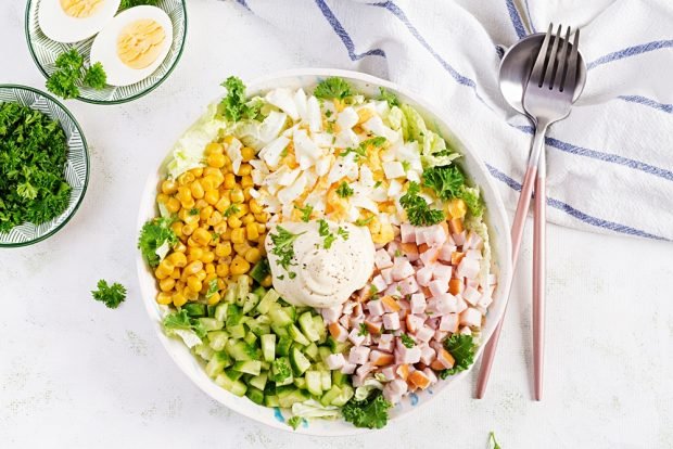 Salad with ham, eggs and cucumbers