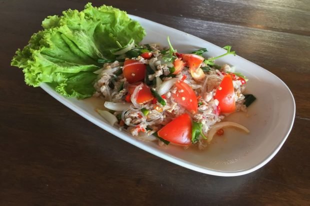 Thai salad of funchosa, minced pork and vegetables