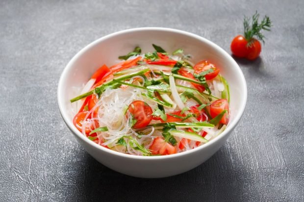 Salad of funchosa, cucumbers, bell peppers and tomatoes 