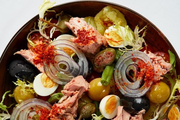 Salad with canned fish and quail eggs