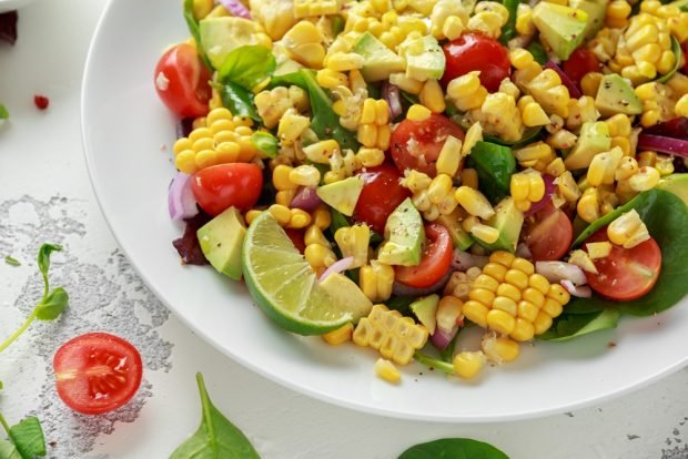 Salad with cherry tomatoes and boiled corn