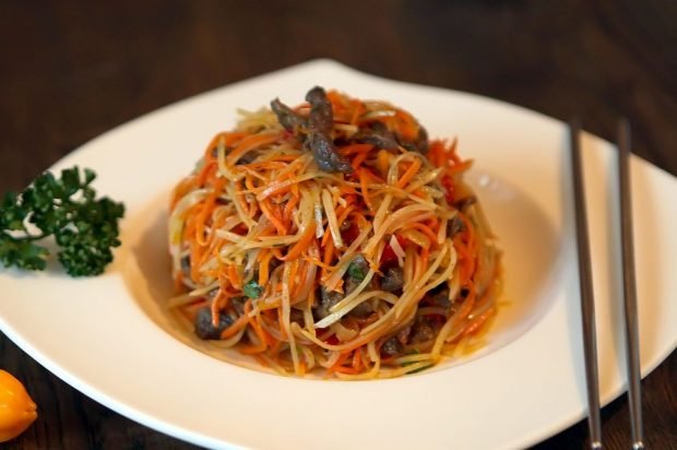 Salad of noodles, fried mushrooms and Korean carrots