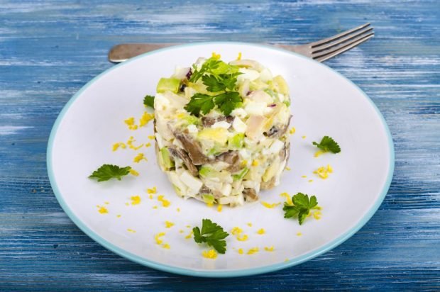 Salad with squid, avocado, mushrooms and egg