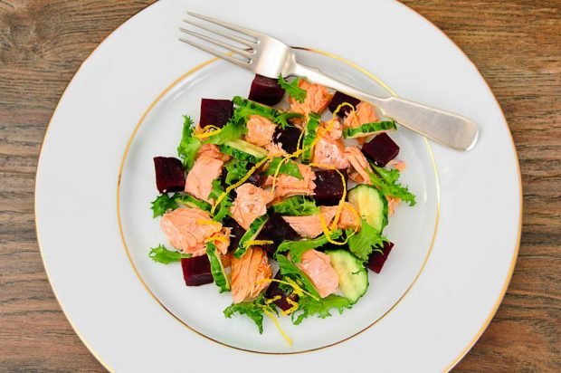 Salad with red fish, cucumbers and beets