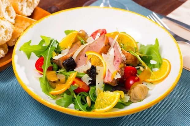 Festive salad with duck, arugula, orange and prunes is a simple and delicious recipe, how to cook step by step