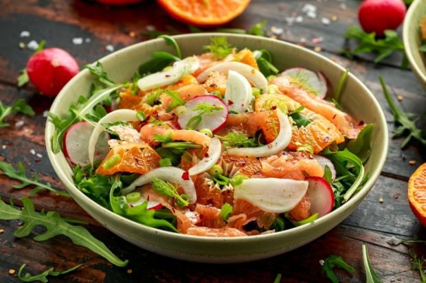 Salad with red fish, radishes and tangerines 