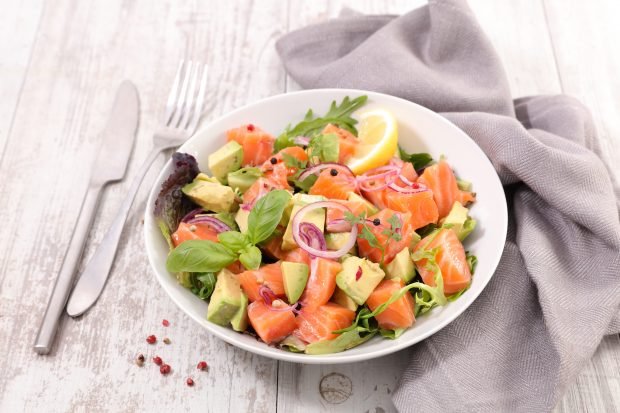 Salad with avocado and red fish