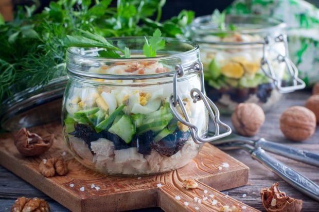 Puff salad with chicken, quail eggs and prunes 