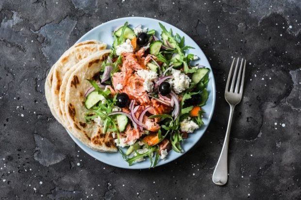 Greek salad with baked red fish