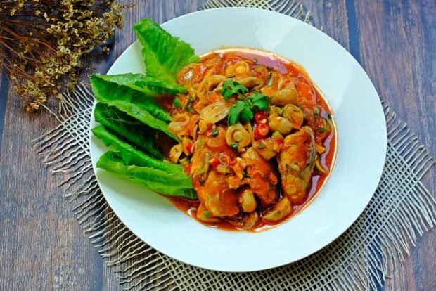 Salad with olives and fish in tomato