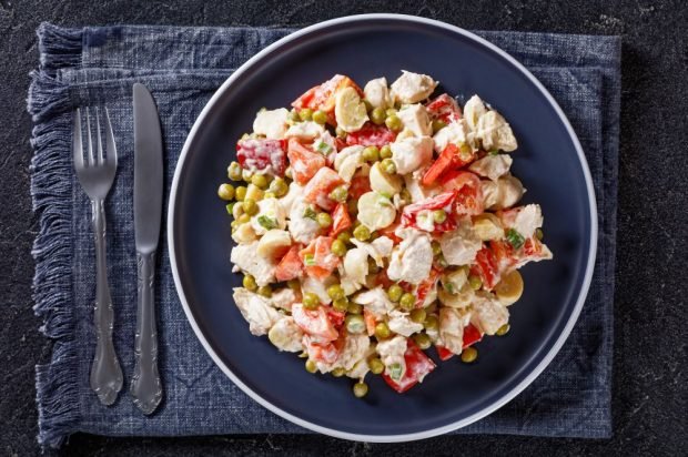 Salad with meat, pickled mushrooms and vegetables