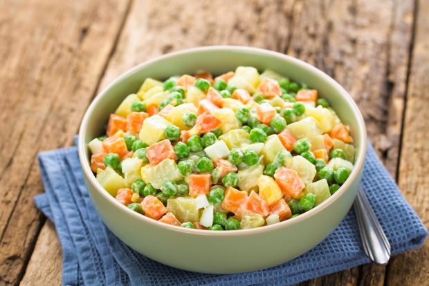 Salad with potatoes, carrots and green peas 