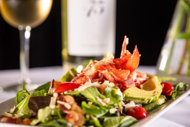 Salad of fresh vegetables with crab meat