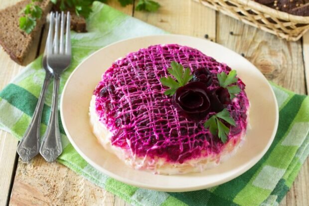 Herring under a fur coat with olives