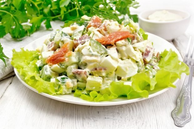 Salad with red fish, cucumbers, avocado and eggs is a simple and delicious recipe, how to cook step by step