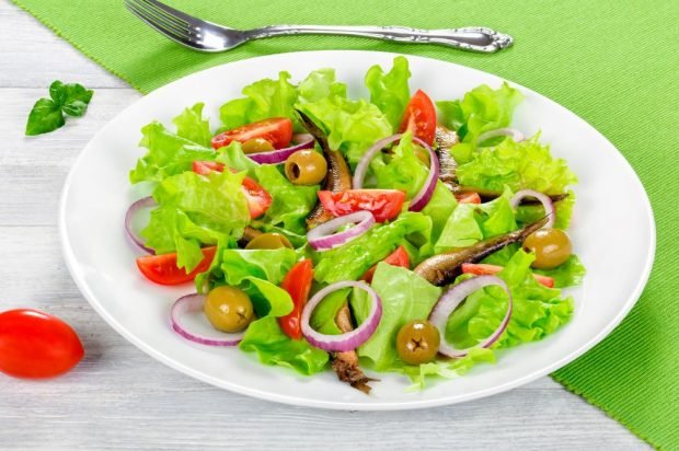 Salad of vegetables, olives and sprats