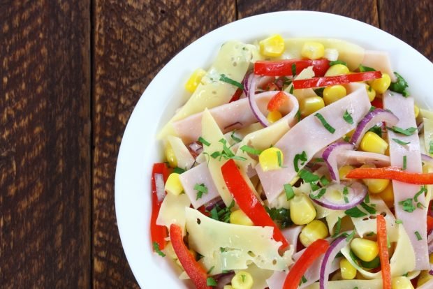 Multicolored salad with cheese and ham