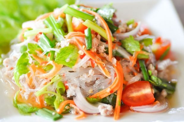 Thai salad of funchosa, canned fish and vegetables 