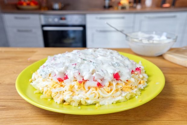 Homemade puff salad of crab sticks