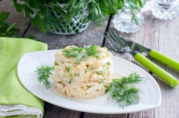 Salad with rice, egg, cucumbers and squid