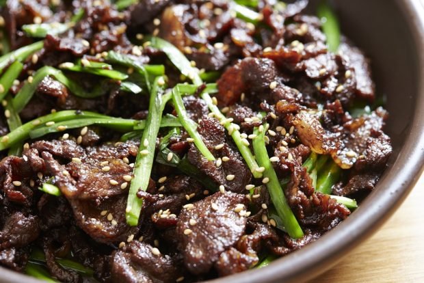 Korean salad with beef and green onions