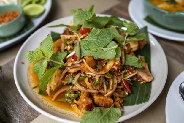 Salad with smoked chicken and mint in soy