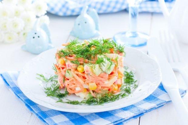 Salad of crab sticks, Korean carrots, corn and cucumbers