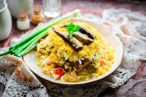 Salad with sprats, pickles, eggs and vegetables 