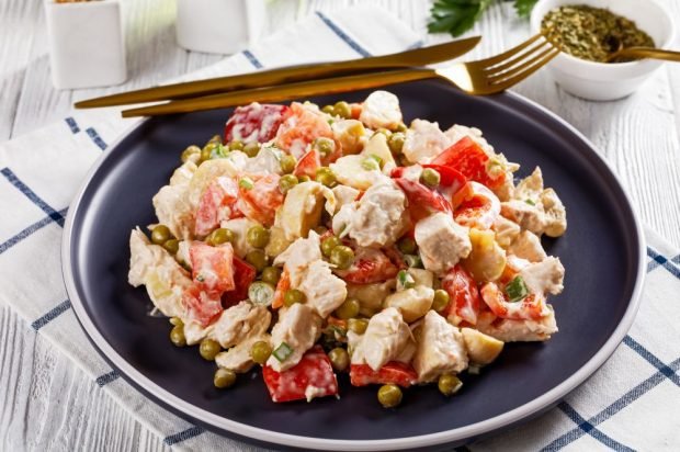 Meat salad with chicken, pickled mushrooms and vegetables