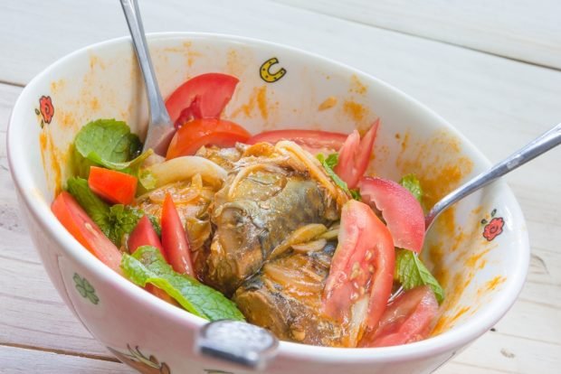 Salad with fish in tomato and fresh tomatoes