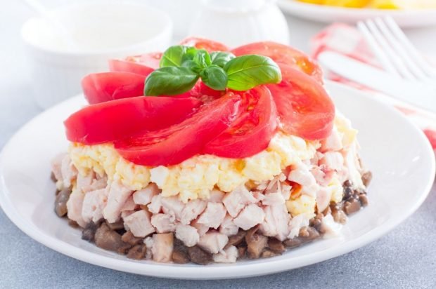 Puff salad with turkey, eggs and champignons