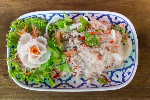 Salad with funchosa, fried minced meat, onions and pickled mushrooms