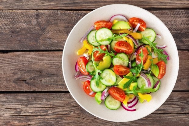 Salad with avocado, tomatoes and cucumbers 