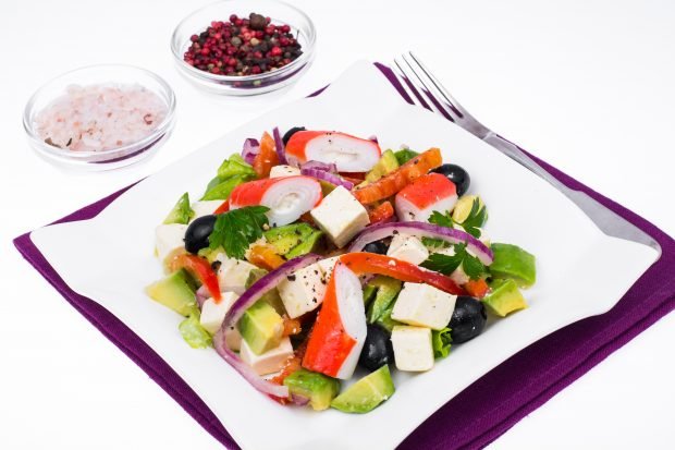 Salad with avocado and crab sticks