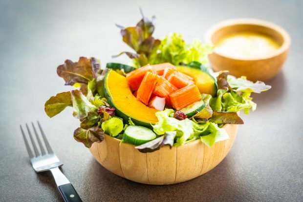 Salad with crab sticks and pumpkin