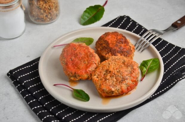 Pork cutlets with mushrooms in tomato sauce