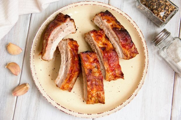 Simple pork ribs in the oven in foil with garlic