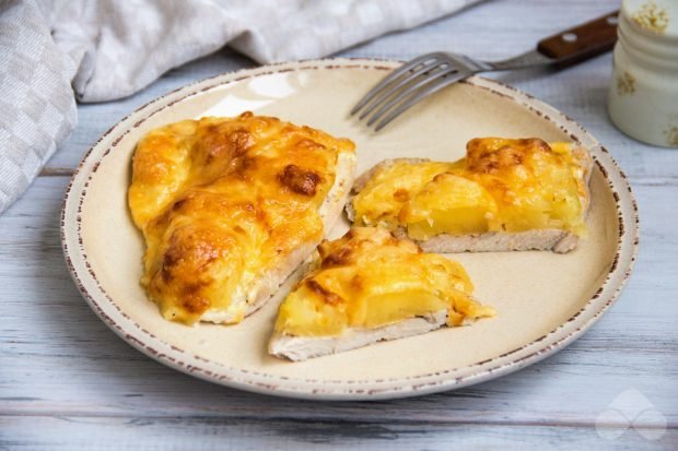 Turkey chops with pineapple and cheese in the oven