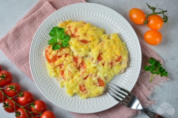 Baked chicken chops with tomatoes and cheese