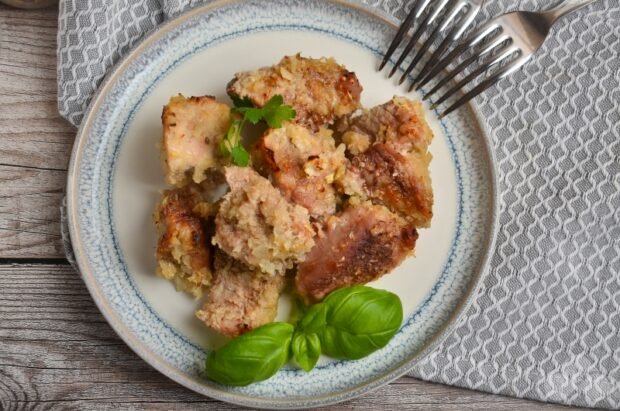 Pork on an onion pillow in the oven