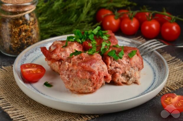 Meatballs with feta cheese in tomato