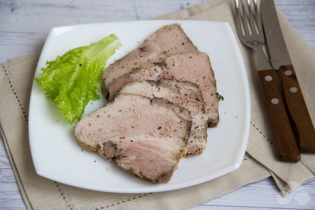 Homemade baked pork in the oven with herbs