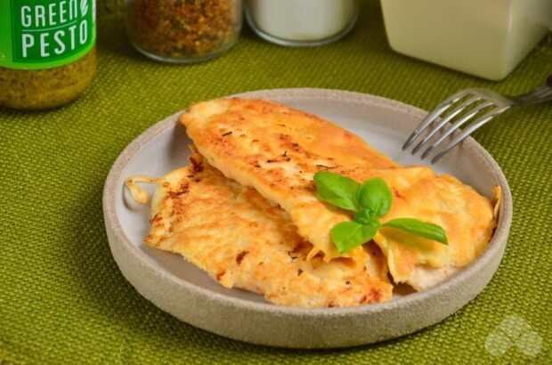 Chicken chops in mayonnaise in a frying pan