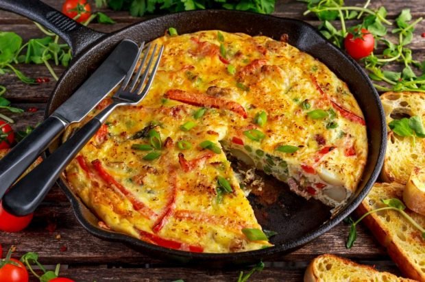 Omelet with bacon, cheese and vegetables