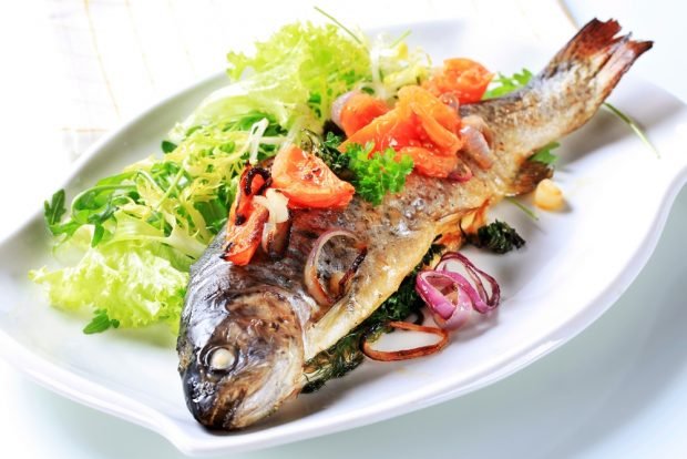 Trout with tomatoes and herbs in the oven 